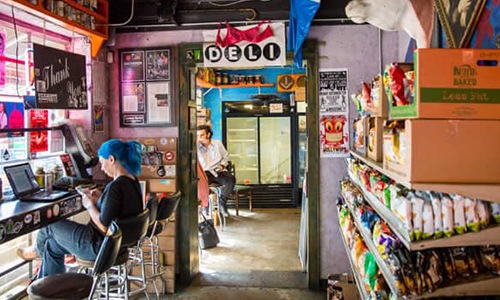 store with a woman on a laptop