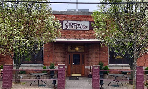 red brick building with a sign on it