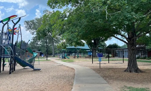 pathway running between two playgrounds
