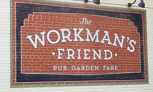 brick wall with sign on it